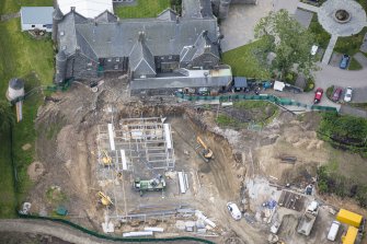 Oblique aerial view of Meldrum House and North Garden House centred on the construction works, looking SSW.
