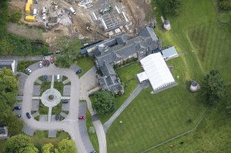 Oblique aerial view of Meldrum House and North Garden House, looking NE.