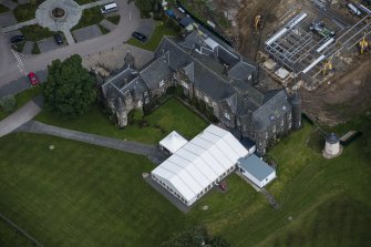 Oblique aerial view of Meldrum House and North Garden House, looking NNW.