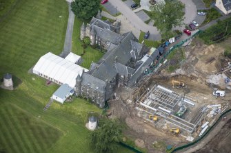 Oblique aerial view of Meldrum House and North Garden House, looking WSW.