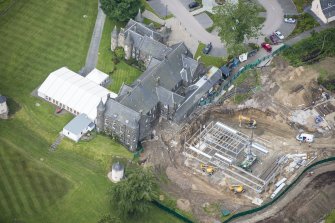 Oblique aerial view of Meldrum House and North Garden House, looking SW.