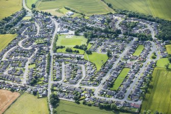 Oblique aerial view of Pitmedden village, looking SSE.