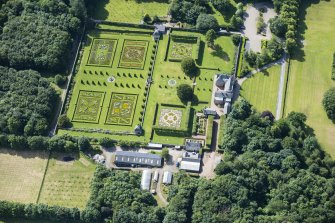 Oblique aerial view of Pitmedden House and walled garden, looking S.