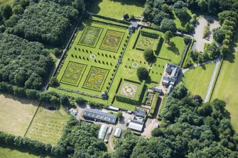 Oblique aerial view of Pitmedden House and walled garden, looking SSE.