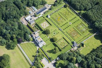 Oblique aerial view of Pitmedden House and walled garden, looking NE.