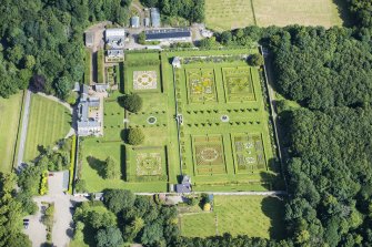 Oblique aerial view of Pitmedden House and walled garden, looking N.