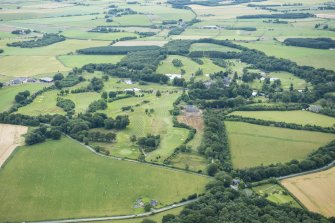 Oblique aerial view of Meldrum House Golf Course, looking E.