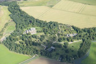 Oblique aerial view of Cambo House and policies, looking E.