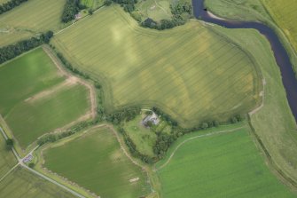 Oblique aerial view of the cropmarks of the souterrains with Mudhall farmsteading adjacent, looking ENE.