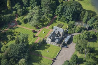 Oblique aerial view of Kirknewton House, looking SW.