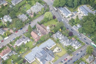 Oblique aerial view of St Cuthbert's Episcopal Church and 1-7 Colinton Rustic Cottages, looking NW.