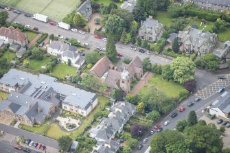 Oblique aerial view of St Cuthbert's Episcopal Church and 1-7 Colinton Rustic Cottages, looking SSW.