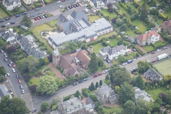 Oblique aerial view of St Cuthbert's Episcopal Church and 1-7 Colinton Rustic Cottages, looking ENE.