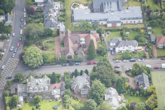 Oblique aerial view of St Cuthbert's Episcopal Church and 1-7 Colinton Rustic Cottages, looking NE.