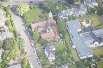 Oblique aerial view of St Cuthbert's Episcopal Church and 1-7 Colinton Rustic Cottages, looking NNW.