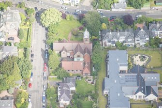 Oblique aerial view of St Cuthbert's Episcopal Church and 1-7 Colinton Rustic Cottages, looking NW.