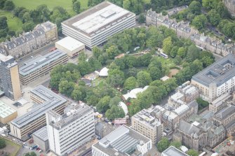 Oblique aerial view of George Square and the Universtiy of Edinburgh Library, looking SSW.