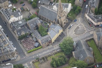 Oblique aerial view of Buccleuch and Greyfriars Free Church and The Pear Tree Public House, looking ENE.