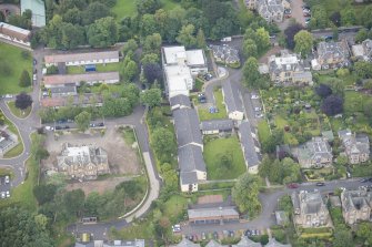 Oblique aerial view of the Astley Ainslie Hospital and Occupational Therapy Training Centre Huts, looking N.