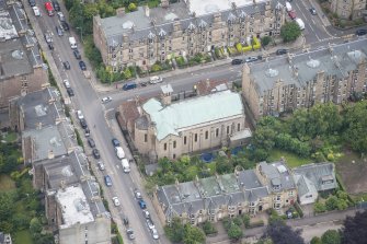 Oblique aerial view of St Peter's Roman Catholic Church and Presbytery, looking SSW.
