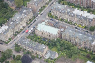 Oblique aerial view of St Peter's Roman Catholic Church and Presbytery, looking SSE.