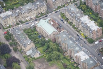 Oblique aerial view of St Peter's Roman Catholic Church and Presbytery, looking SE.