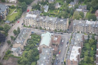 Oblique aerial view of St Peter's Roman Catholic Church and Presbytery, looking E.