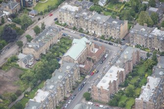 Oblique aerial view of St Peter's Roman Catholic Church and Presbytery, looking ENE.
