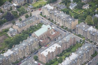 Oblique aerial view of St Peter's Roman Catholic Church and Presbytery, looking NE.