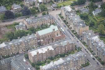 Oblique aerial view of St Peter's Roman Catholic Church and Presbytery, looking NNE.