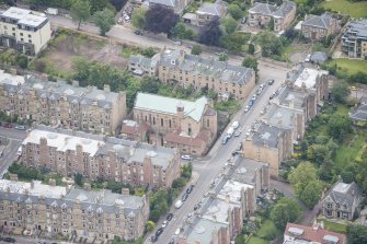 Oblique aerial view of St Peter's Roman Catholic Church and Presbytery, looking NNW.