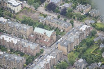 Oblique aerial view of St Peter's Roman Catholic Church and Presbytery, looking NW.