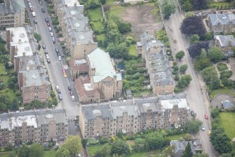 Oblique aerial view of St Peter's Roman Catholic Church and Presbytery, looking W.