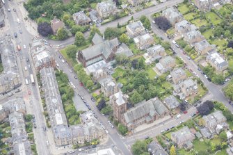 Oblique aerial view of St Matthew's Parish Church and Morningside South United Free Church, looking NE.
