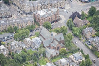 Oblique aerial view of St Matthew's Parish Church and Morningside South United Free Church, looking WNW.