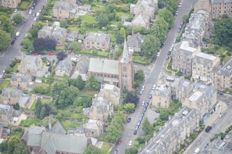 Oblique aerial view of Morningside South United Free Church, looking S.