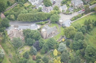Oblique aerial view of Duddingston Parish Church, Churchyard and Watch Tower, looking N.