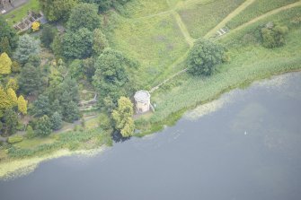 Oblique aerial view of Duddingston Manse Curling House, looking N.