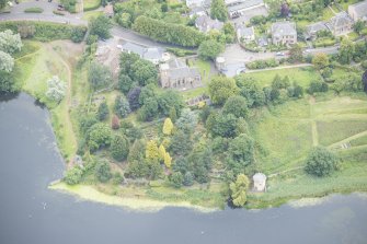 Oblique aerial view of Duddingston Parish Church and Watch Tower, looking NNW.