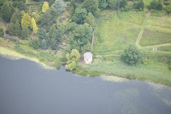 Oblique aerial view of Duddingston Manse Curling House, looking NNW.