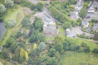 Oblique aerial view of Duddingston Parish Church, Churchyard and Watch Tower, looking NW.