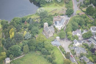 Oblique aerial view of Duddingston Parish Church, Churchyard and Watch Tower, looking W.