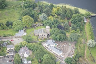 Oblique aerial view of Duddingston Parish Church, Churchyard and Watch Tower, looking S.