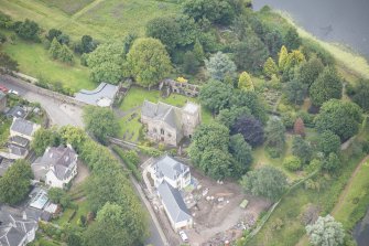 Oblique aerial view of Duddingston Parish Church, Churchyard and Watch Tower, looking SSE.