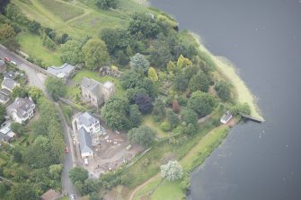 Oblique aerial view of Duddingston Parish Church, Churchyard and Watch Tower, looking SE.