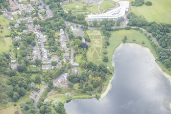 Oblique aerial view of Duddingston Parish Church, Churchyard and Watch Tower, looking WSW.