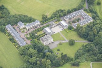 Oblique aerial view of Duddingston House, Offices and Stables, looking WNW.