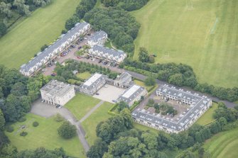 Oblique aerial view of Duddingston House, Offices and Stables, looking SW.