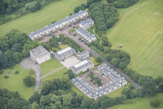 Oblique aerial view of Duddingston House, Offices and Stables, looking SSW.