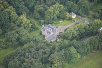 Oblique aerial view of Morton House, Garage and Walled Courtyard, looking SW.